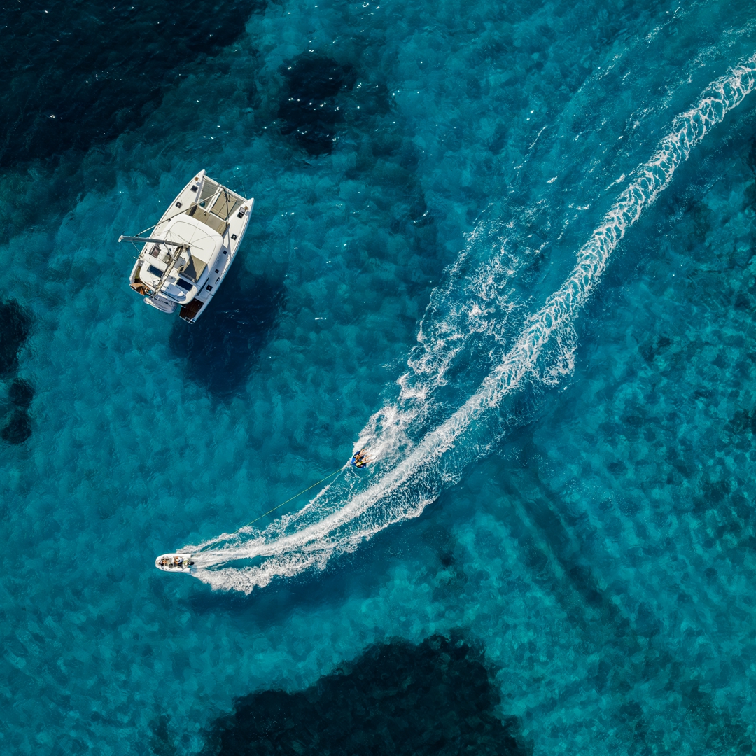 Catamaran JOY anchored near Kalamos.